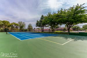 View of tennis court featuring community basketball court