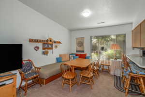 Dining room featuring light colored carpet
