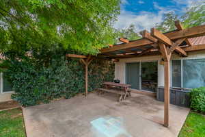 View of patio featuring a pergola and outdoor dining space