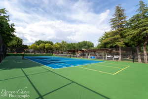 View of tennis court featuring community basketball court