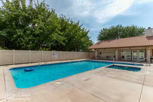 Community pool with a patio area, french doors, and a community hot tub