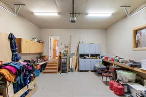 Garage featuring a garage door opener