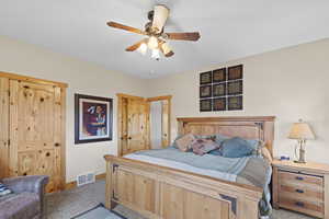 Bedroom featuring carpet and ceiling fan