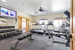 Exercise room featuring a ceiling fan and recessed lighting
