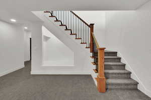 Stairs featuring carpet floors and recessed lighting