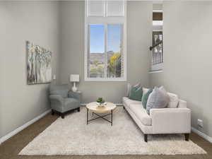 Living area featuring carpet flooring and plenty of natural light