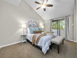 Bedroom featuring high vaulted ceiling, carpet floors, and ceiling fan