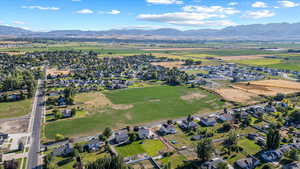 View of property location with a mountainous background and nearby suburban area