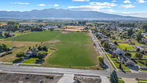 Aerial perspective of suburban area featuring a mountain backdrop