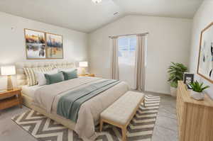 Primary bedroom with lofted ceiling and carpet, ensuite bathroom & walk-in closet