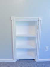 Detailed view of carpet flooring and baseboards