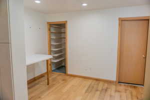 Unfurnished office with recessed lighting and light wood-style flooring