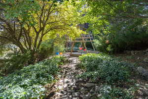 View of yard with a wooden deck