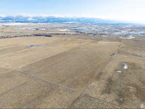 Aerial view of sparsely populated area featuring a mountainous background