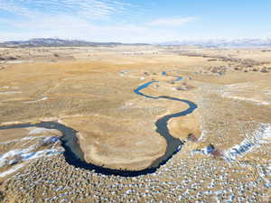 Aerial view of property's location featuring mountains and rural landscape