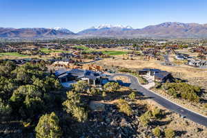 Aerial perspective of suburban area featuring a mountainous background