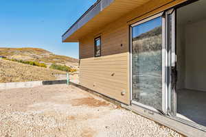 View of side of property featuring a mountain view