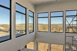 Unfurnished sunroom with a mountain view