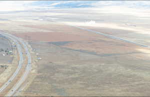 Aerial view of property and surrounding area with rural landscape