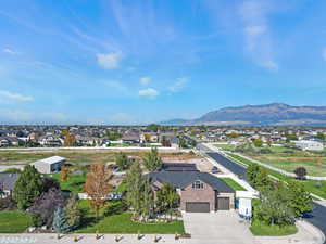 Aerial view of residential area featuring mountains