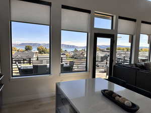 Dining space with a mountain view, light wood-style flooring, and a residential view