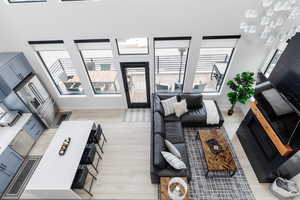 Living area featuring plenty of natural light and light wood finished floors