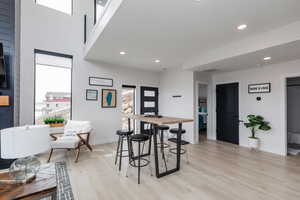 Dining area featuring light wood finished floors and recessed lighting