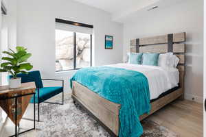 Bedroom featuring light wood-type flooring and baseboards