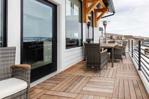 Wooden deck featuring outdoor dining space