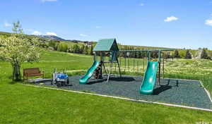 Community playground featuring a yard and a view of rural / pastoral area