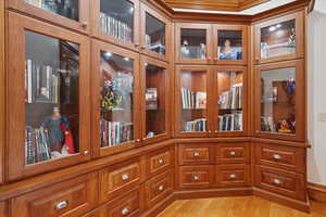 Detailed view of wood finished floors and crown molding