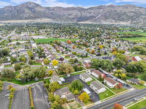 Aerial view of residential area featuring a mountainous background