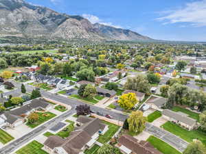 Aerial view of residential area featuring a mountainous background