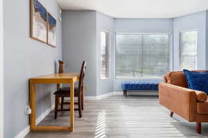 Office area with wood finished floors and baseboards