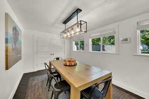 Dining room featuring healthy amount of natural light and a textured ceiling