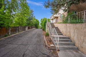 View of asphalt road with stairs