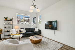 Living room with wood finished floors and baseboards
