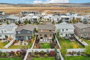 Aerial perspective of suburban area with a mountainous background