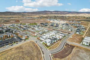 View of property location with a mountainous background and nearby suburban area