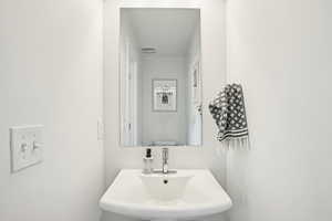 Bathroom featuring a sink and toilet