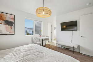 Bedroom with carpet floors and ensuite bath