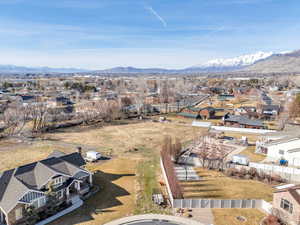 Aerial perspective of suburban area with a mountainous background