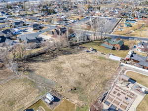 Aerial view of property's location featuring nearby suburban area