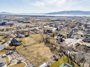 Aerial overview of property's location featuring nearby suburban area and a mountainous background