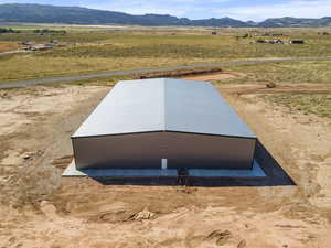 Overview of rural landscape featuring a mountainous background