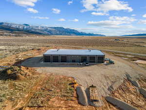 View of rural area with a mountainous background and a desert landscape