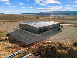 View of rural area with a mountain backdrop and a desert landscape
