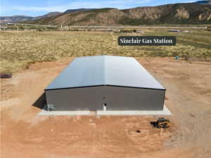 View of storm shelter with a mountain view and a view of rural / pastoral area