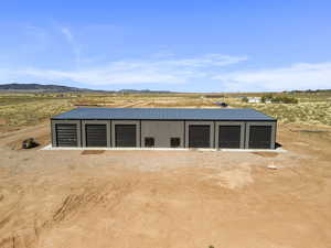 Garage with a mountain view, view of desert landscape, and a rural view
