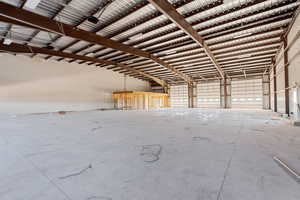 Garage featuring metal wall